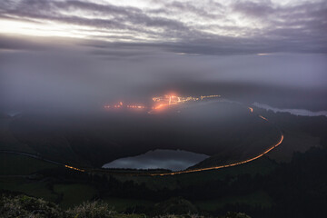 Naklejka na ściany i meble Fog over a lake in a volcanic island