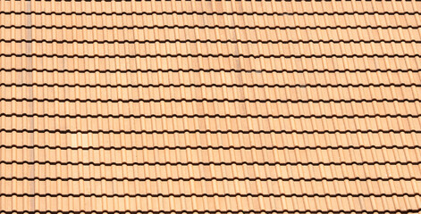 Closeup of orange clay roof tile seamless pattern for house covering in red color