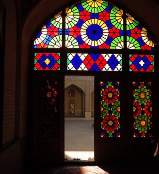 The colourful stained glass with window arch frame at nasir al mulk mosque.the decoration of stained glass at window frame. the famous mosque  at shiraz iran 