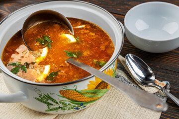Red soup with vegetables and meat, tasty, traditional Ukrainian borsch, close-up, shallow depth of field, selective focus. Healthy Organic Homemade Food Concept