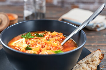 Red soup with vegetables and meat, tasty, traditional Ukrainian borsch, close-up, shallow depth of field, selective focus. Healthy Organic Homemade Food Concept