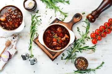 Bograch. Vegetable soup with meat and hot chili peppers. Hungarian traditional food. Top view. Free...