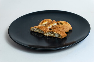 Mediterranean pastries with almonds in a dark plate