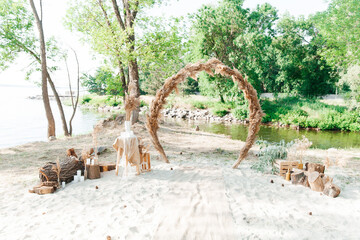 Wedding decor and arch, rustic style with straw and wedding rings