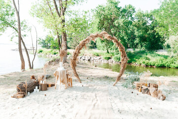 Wedding decor and arch, rustic style with straw and wedding rings