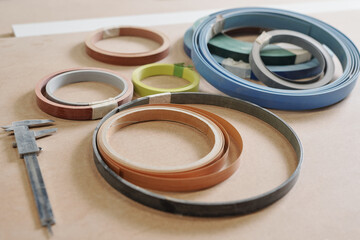 Rolled multi-color working materials for furniture production and calipers