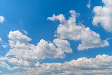 Naklejka na ściany i meble white clouds in the blue sky in sunny weather