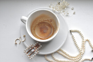 Cup of coffee with accessories on the table