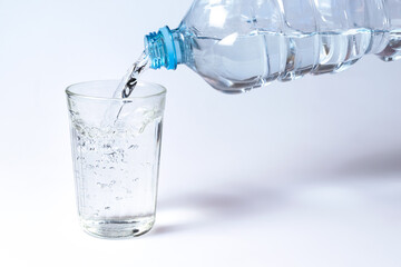 Water pouring into a faceted glass