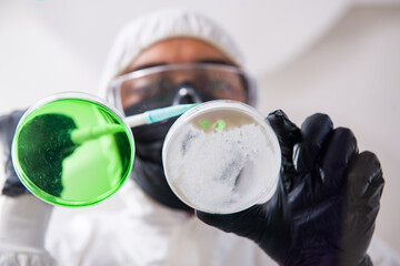 Young male chemist working in the lab