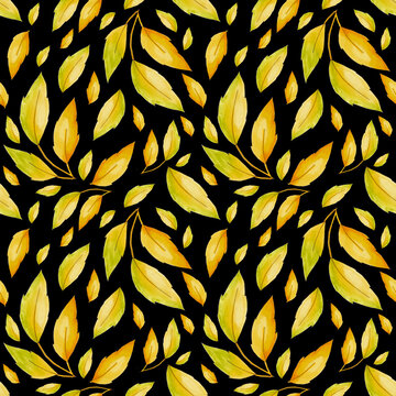 Seamless pattern with yellow autumn leaves on a black background.