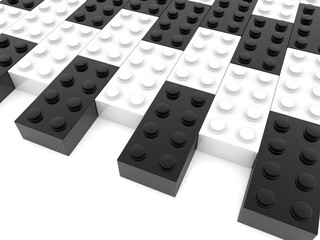 Black and white toy bricks on white