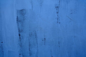 Blue Brush Stroke Painting on Concrete Wall Texture Background.