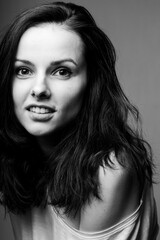 Fototapeta premium beautiful girl in a white T-shirt smiles, laughs. Black and white photography