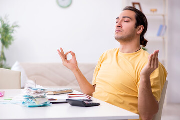Young man in budget planning concept