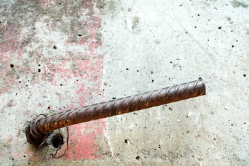 Structural Steel Bar Protruding from Concrete Wall.