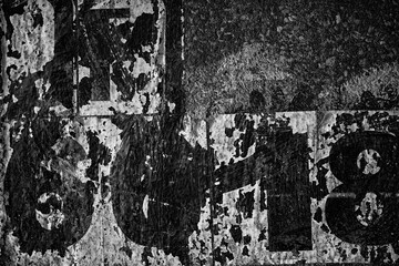Naklejka premium Old Peeling Vintage Posters on Grunge Concrete Wall Texture Background.