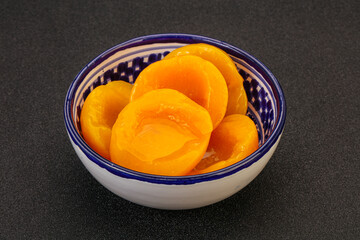 Marinated peaches fruit in the bowl