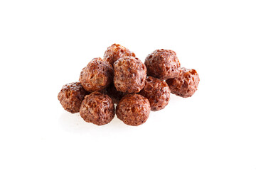 Chocolate corn balls isolated on white background. Chocolate balls dry breakfast scattered on a white background. Space for text. Also known as Chocolate flakes. Full depth of field.