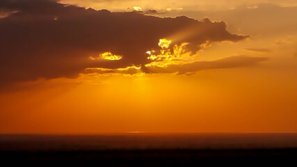 very beautiful sunset behind the clouds