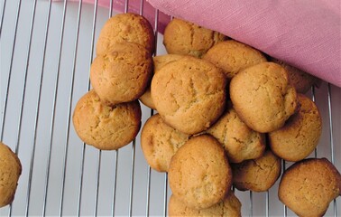 Peanut ginger gallets on the grid. And pink linen.