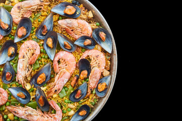 transparency cut, black background, paella typical Spanish food