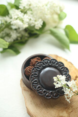 On a white background chocolate box, flowers.
