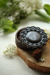 On a white background chocolate box, flowers.
