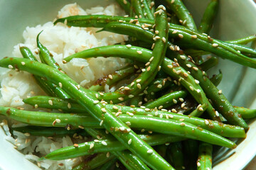 Sauteed Green String Beans with Sesame Seeds and Chili Paste in a Bowl with White Rice