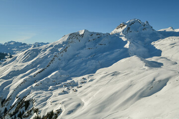 Snow covered mountain huts above the Grindelwald village