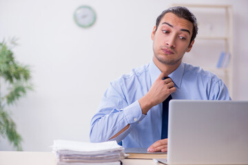 Young male employee in the office