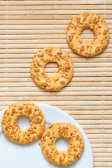 Shortbread cookies in plate on old wooden background, top view with copy space