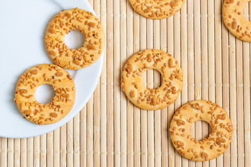 Shortbread cookies in plate on old wooden background, top view with copy space