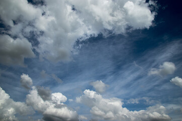Blue sky, high, majestic Cumulus clouds, the Sun.