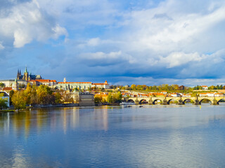 Cityscape with the Vltava River, The Prague Castle and The Saint Vitus Cathedral in Prague, copy space for text.