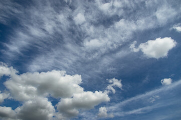 Blue sky, high, majestic Cumulus clouds, the Sun.