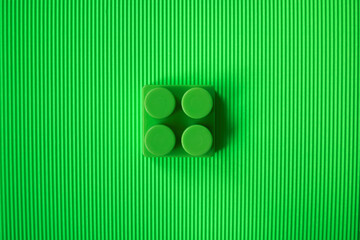 A block from the builder on a green background