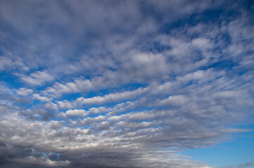 Blue sky, high, majestic Cumulus clouds, the Sun.