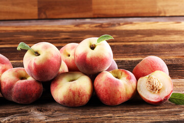 A group of ripe peaches on wooden table