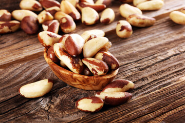Brazil nuts on vintage background. unshelled Bertholletia healthy vegetarian food