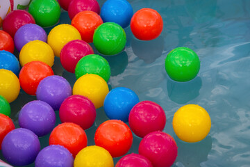 Fototapeta na wymiar Colorful plastic balls in a pool. Games