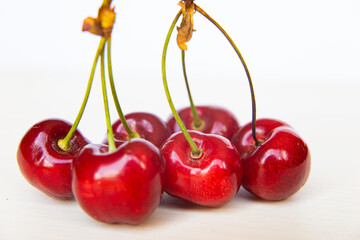 Ripe cherries on wooden surface