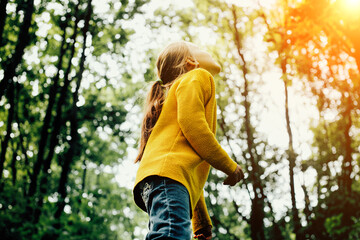 A child looks up into the sky