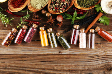 Fototapeta na wymiar Spices and herbs on table. Food and organic cuisine ingredients.