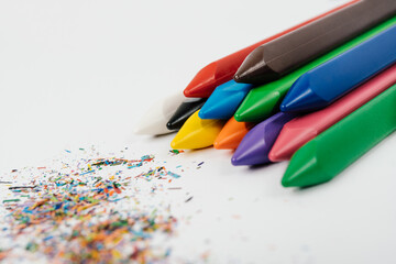 Photo of wax crayons background with waste