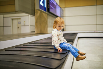 Adorable little girl in the airport