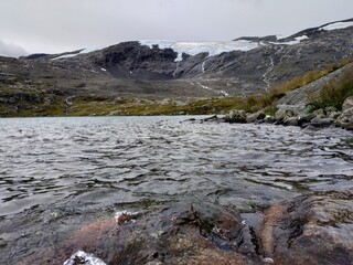 View on Geiranger fjord, rocks and the valley at cloudy weather.