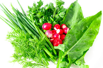 Greens and radishes for salad on a white background. Vitamin and healthy food