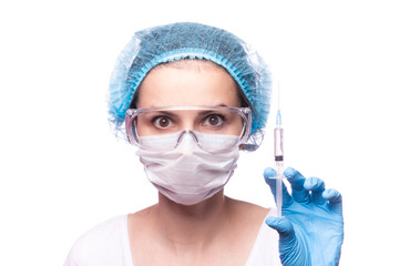 woman in medical mask wearing glasses and gloves is holding a syringe