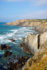 rocky cliff at typical beach at the west coast of Portugal